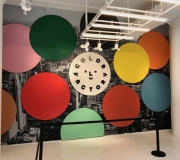 At Color Factory in NYC , entry way graphic wallpaper and dimensional circles.