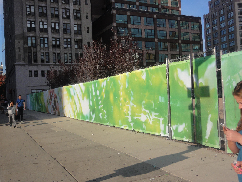 Art installation uses vinyl mesh to cover fence at construction site