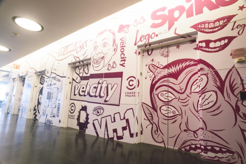 This space comes alive with wall mural and elevator wraps in corporate headquarters