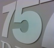 Dimensional lettering and numbering are used for wayfinding graphics.
