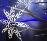 Snowflake is direct print to acrylic using white ink and routing to shape backed with LED lights