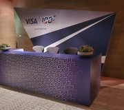 custom fabricated MDF welcome desk with vinyl wrap and fabric printed backdrop