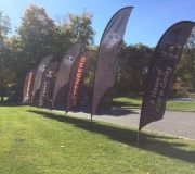 Sporting event graphics. Bow flags are great for outdoor branding of environments