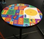 Vinyl can be used in many exciting ways . here, table to pis wrapped with vinyl for branding .