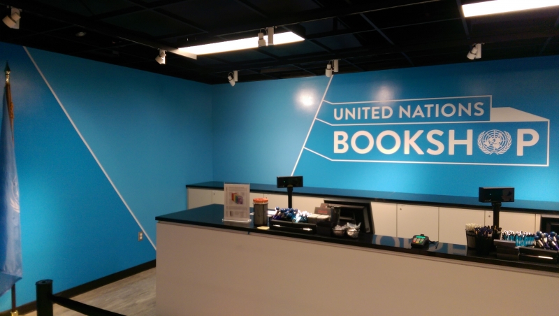 Vinyl printed wall mural for book store at United Nations adds a pop of color .