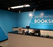 Vinyl printed wall mural for book store at United Nations adds a pop of color .