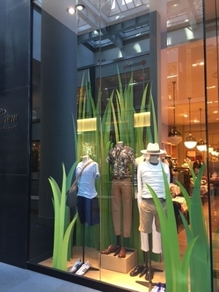 spring windows for national retailer . Green grass is printed and fabricated .