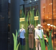 spring windows for national retailer . Green grass is printed and fabricated .
