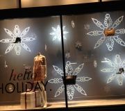 Holiday window graphics are custom made with precision cutting to shape of acrylic and fabricated with LED lights