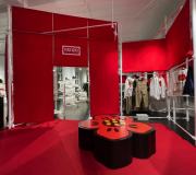 Pop up shop graphics include custom printed carpet, fabric drapes, cnc and custom paint dimensional bench .