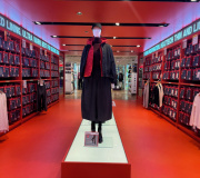 The red vinyl wraps the floor , ceiling and shelving bringing in the warmth to the space .   Color X are THE experts for vinyl and installations .