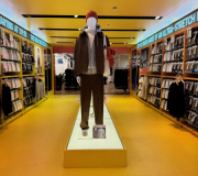 Printed vinyl with vibrant colors were used to help transform this retail space.  Our team of installation experts wrapped all shelving, the floor and ceiling with vinyl. 