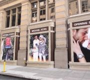 large format graphics are used to cover windows on fifth ave., NYC.